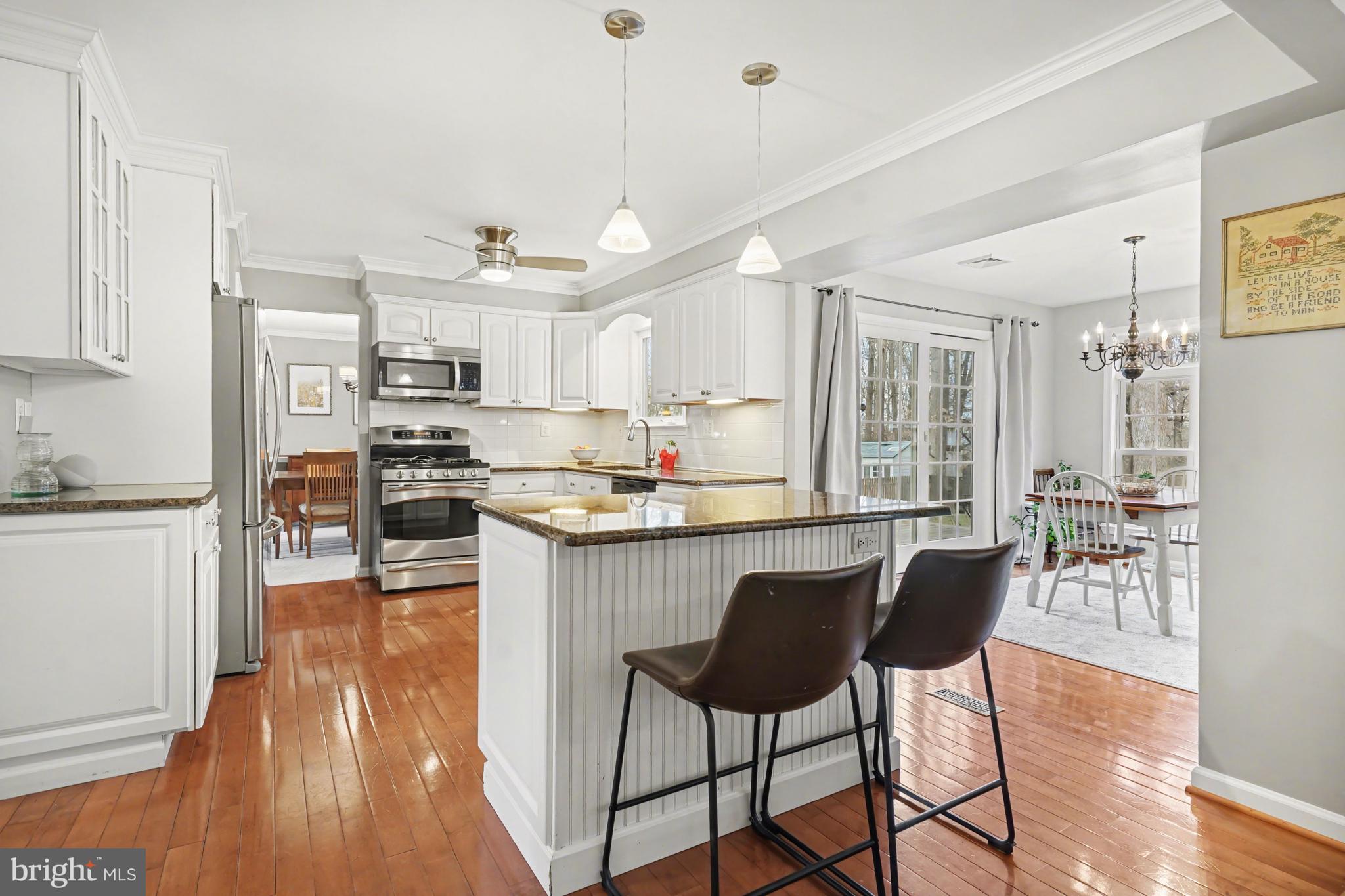 219 Twining Road Lansdale, PA 19446 - Photo 13 of 39 a kitchen with cabinets and wooden floor