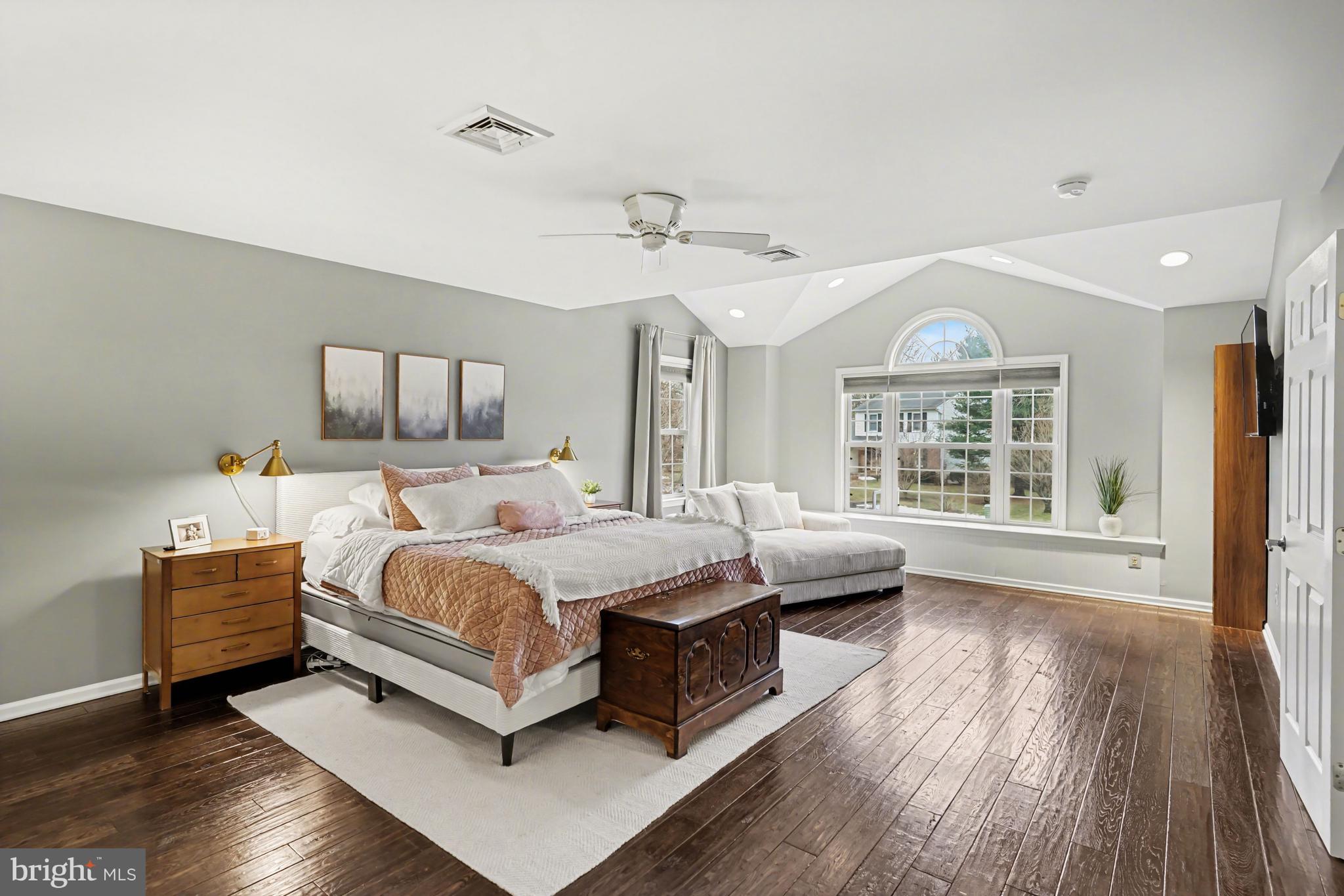 219 Twining Road Lansdale, PA 19446 - Photo 19 of 39 a spacious bedroom with a bed couch and a large window