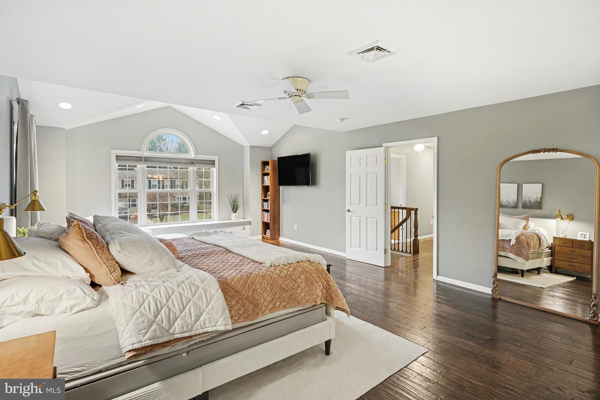 219 Twining Road Lansdale, PA 19446 - Photo 22 of 39 a bedroom with a large bed and wooden floor