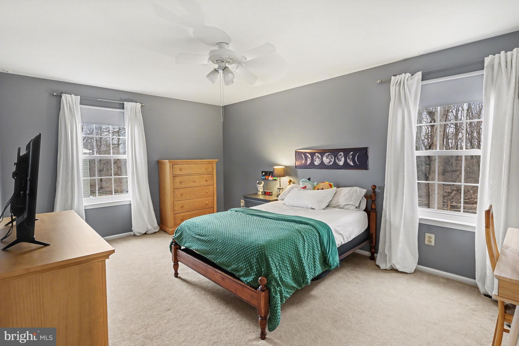 219 Twining Road Lansdale, PA 19446 - Photo 27 of 39 a bedroom with a bed and a flat tv screen on dresser