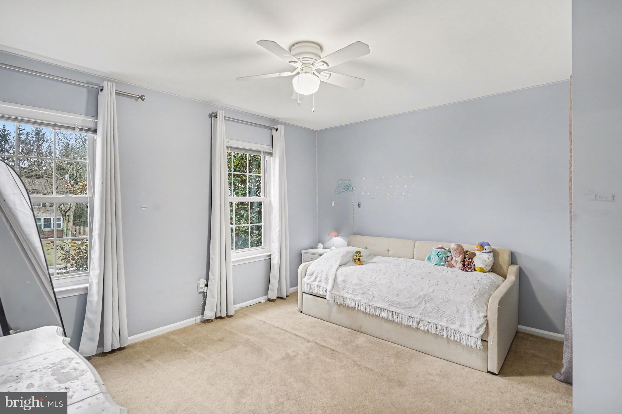 219 Twining Road Lansdale, PA 19446 - Photo 28 of 39 a bedroom with a bed and window with a chandelier