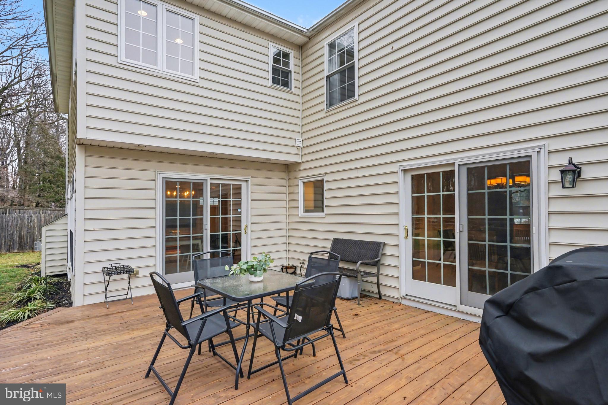 219 Twining Road Lansdale, PA 19446 - Photo 32 of 39 a view of a patio with table and chairs and wooden floor