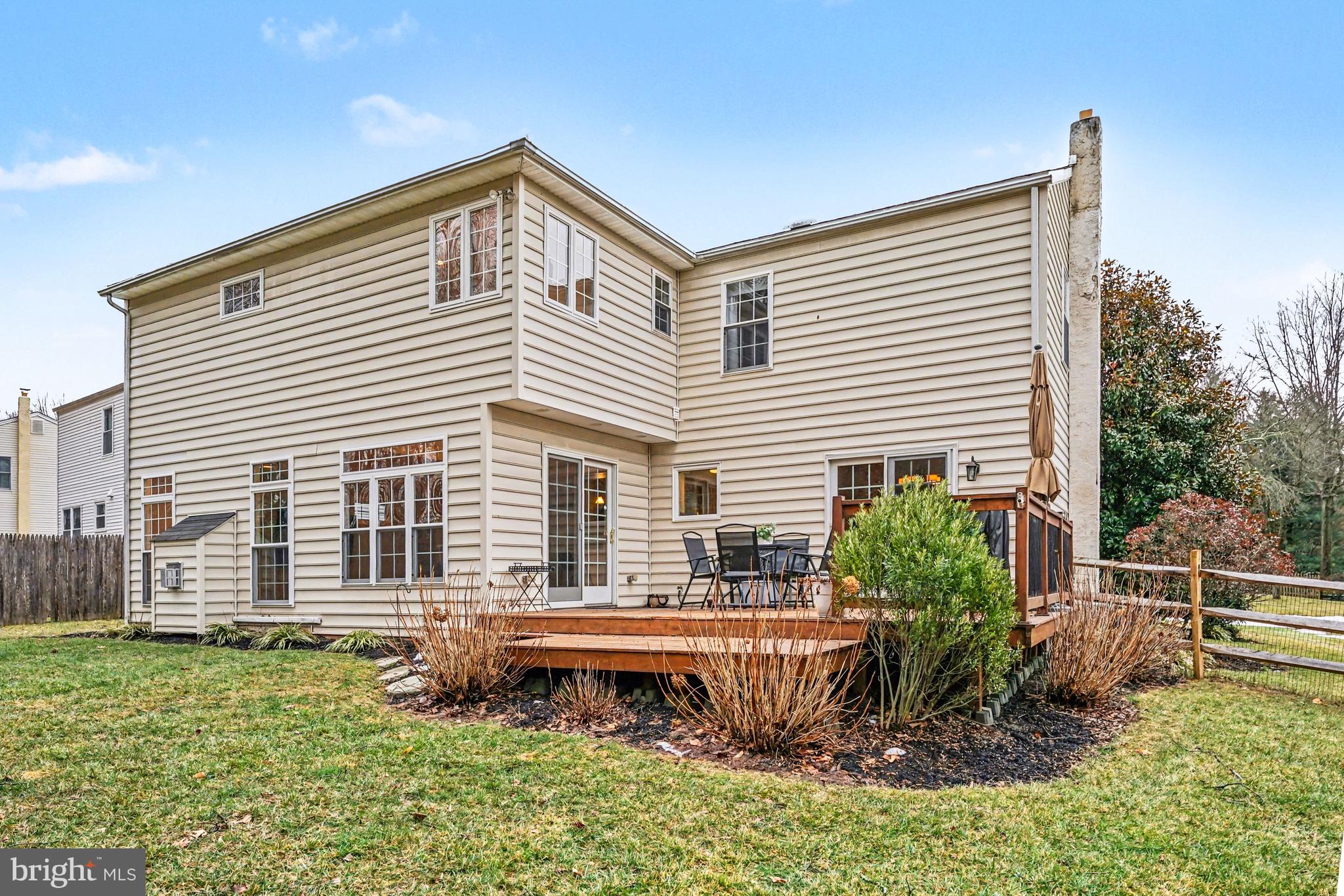 219 Twining Road Lansdale, PA 19446 - Photo 35 of 39 a backyard of a house with plants and outdoor seating