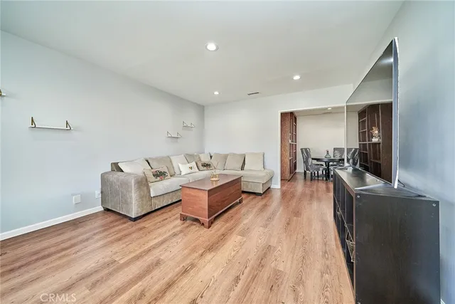 a workspace with furniture wooden floor and window