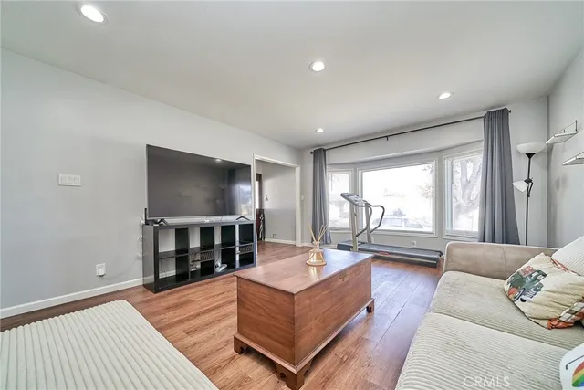 a large kitchen with stainless steel appliances sink and cabinets