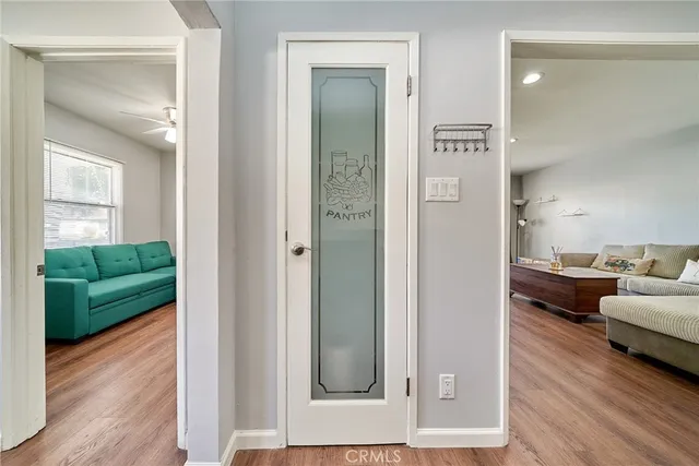 a spacious bedroom with a bed and a ceiling fan