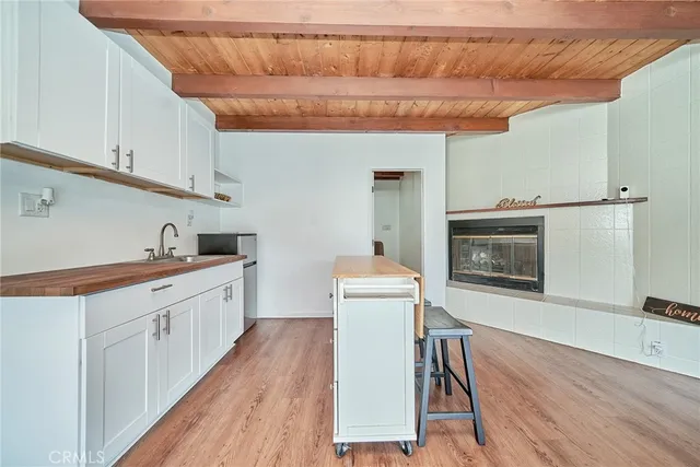a bathroom with a granite countertop sink mirror vanity and toilet