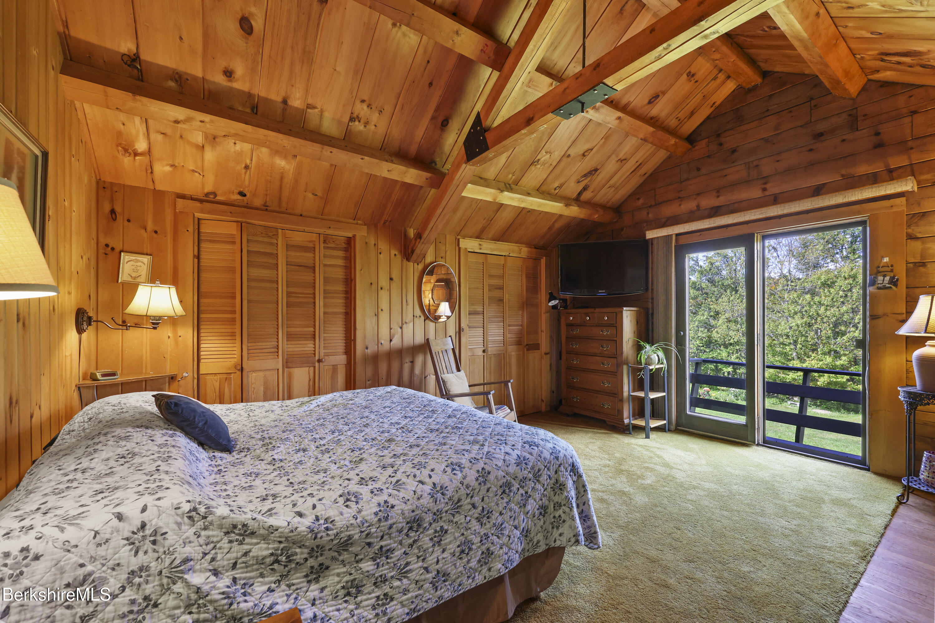 78 East Main Road Peru, MA 01235 - Photo 29 of 56 a bedroom with a large bed and wooden floor