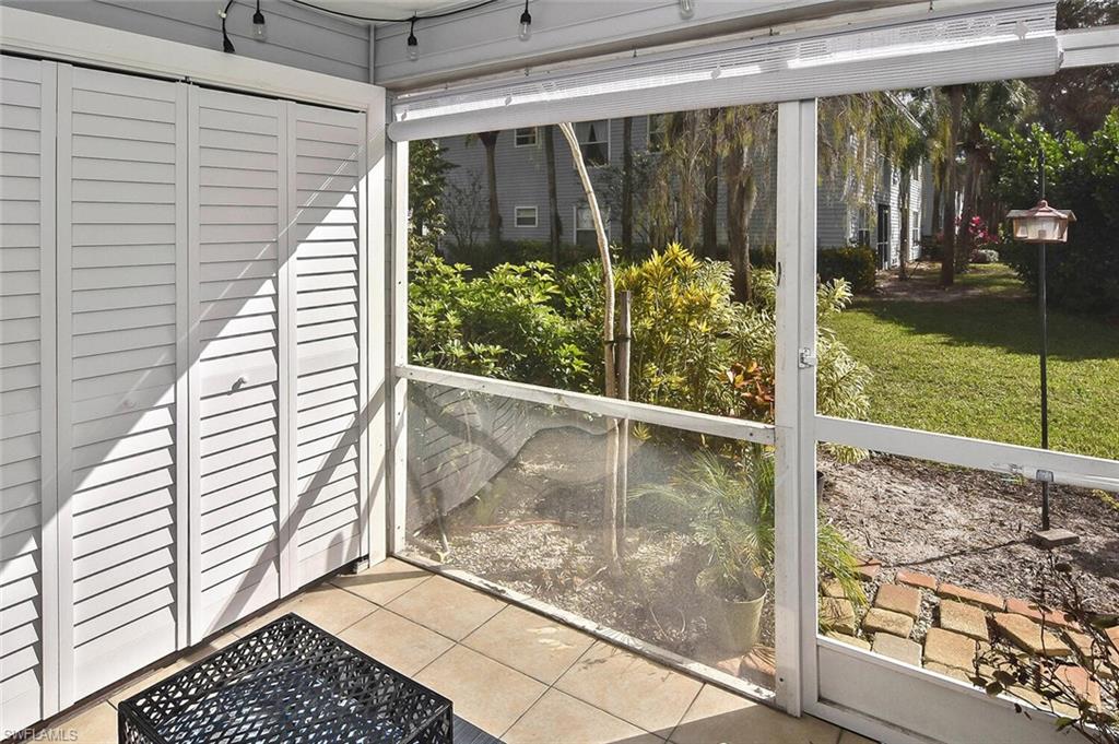 1895 Courtyard Way, Unit B103 Naples, FL 34112 - Photo 11 of 32 a view of a garden
