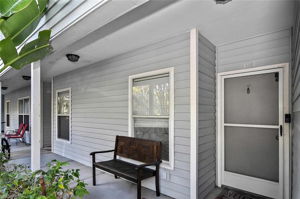 1895 Courtyard Way, Unit B103 Naples, FL 34112 - Photo 2 of 32 a outdoor space with a bench
