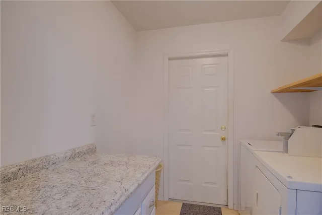 a bathroom with a granite countertop sink and vanity