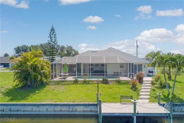 a view of a swimming pool with a patio
