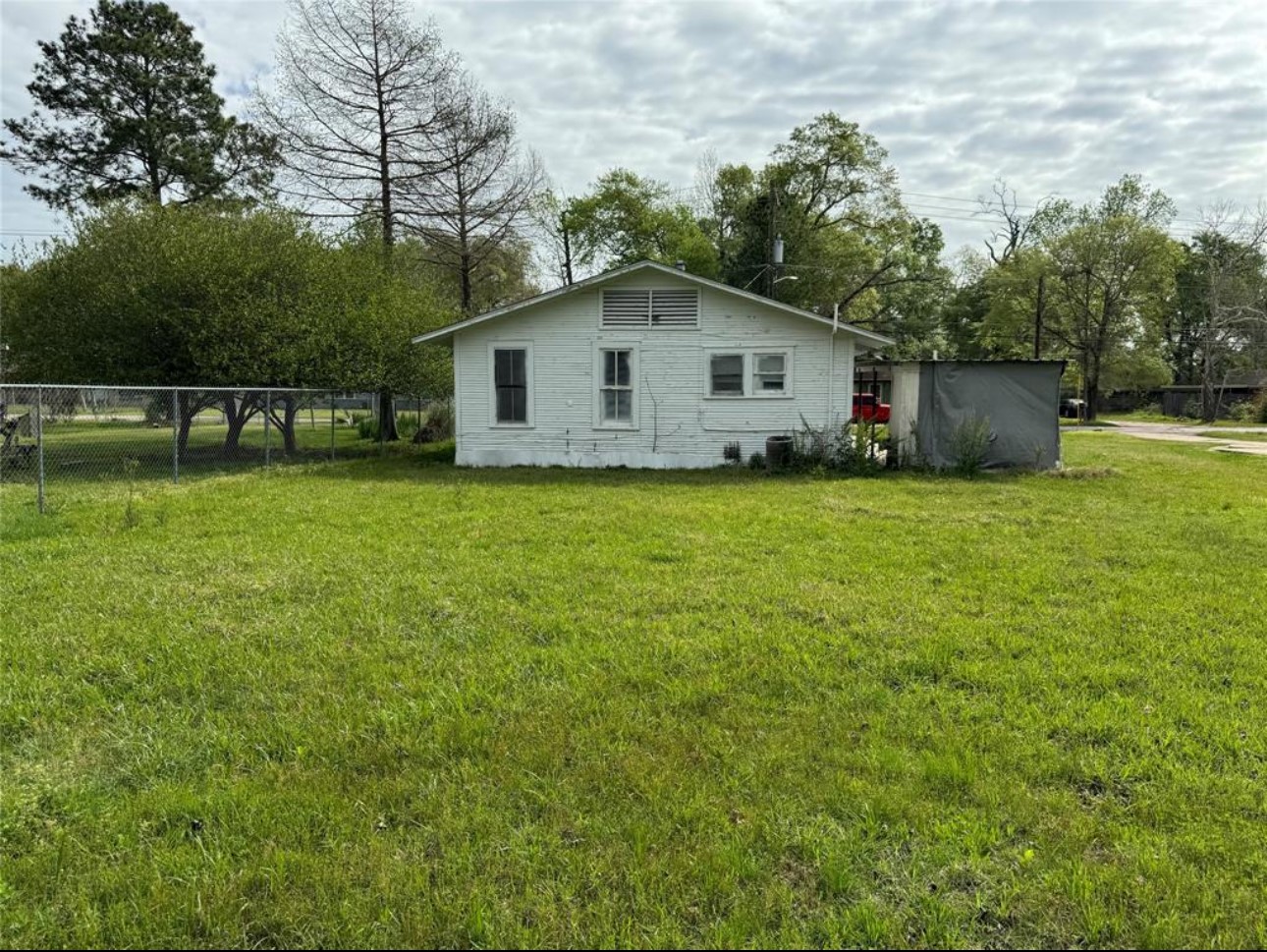 500 Tanner Avenue Cleveland, TX 77327 - Photo 8 of 9 a backyard of a house with lots of green space