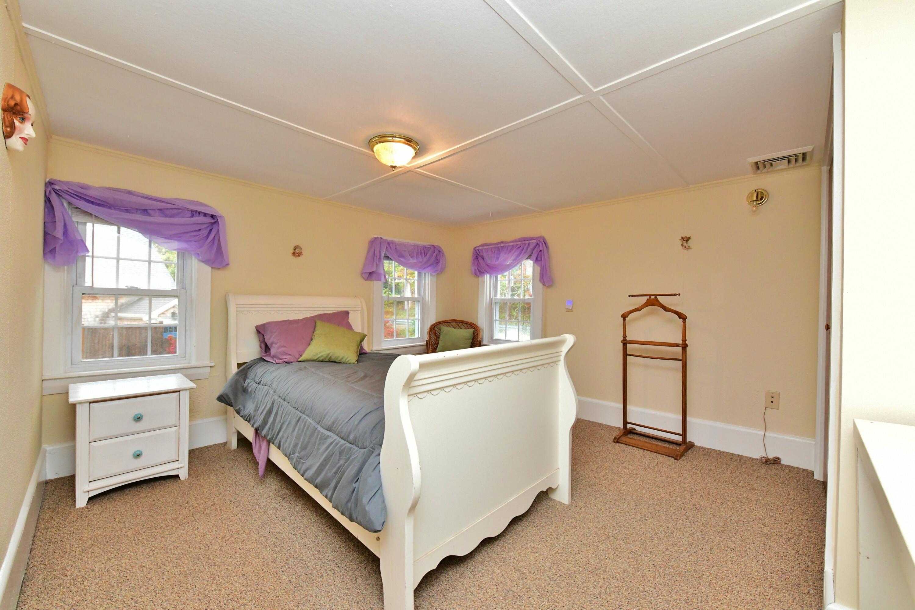 6 Bournedale Road, Unit 6B 2 Buzzards Bay, MA 02532 - Photo 17 of 36 a bed room with a bed and a window