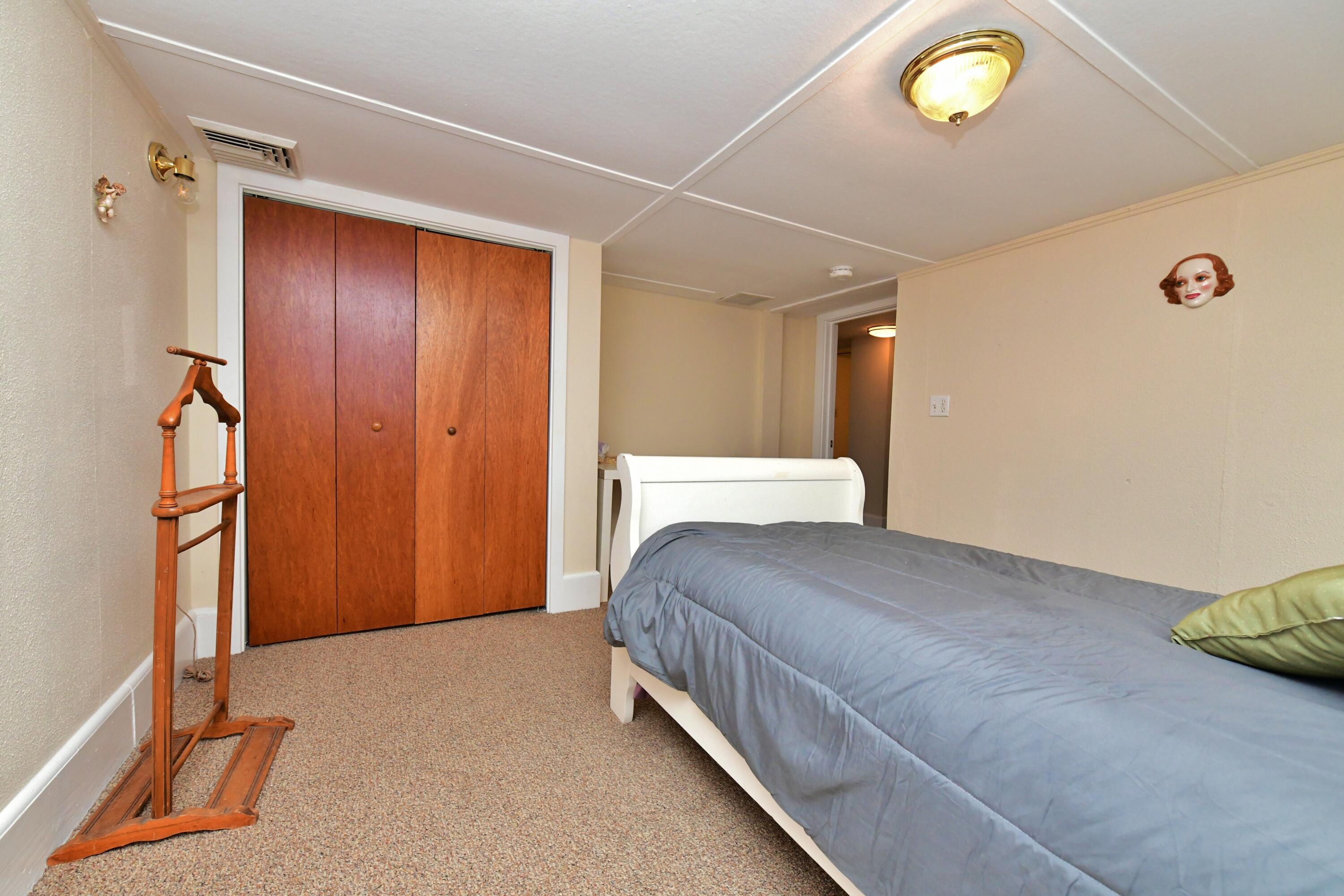 6 Bournedale Road, Unit 6B 2 Buzzards Bay, MA 02532 - Photo 18 of 36 a bedroom with a bed and a window