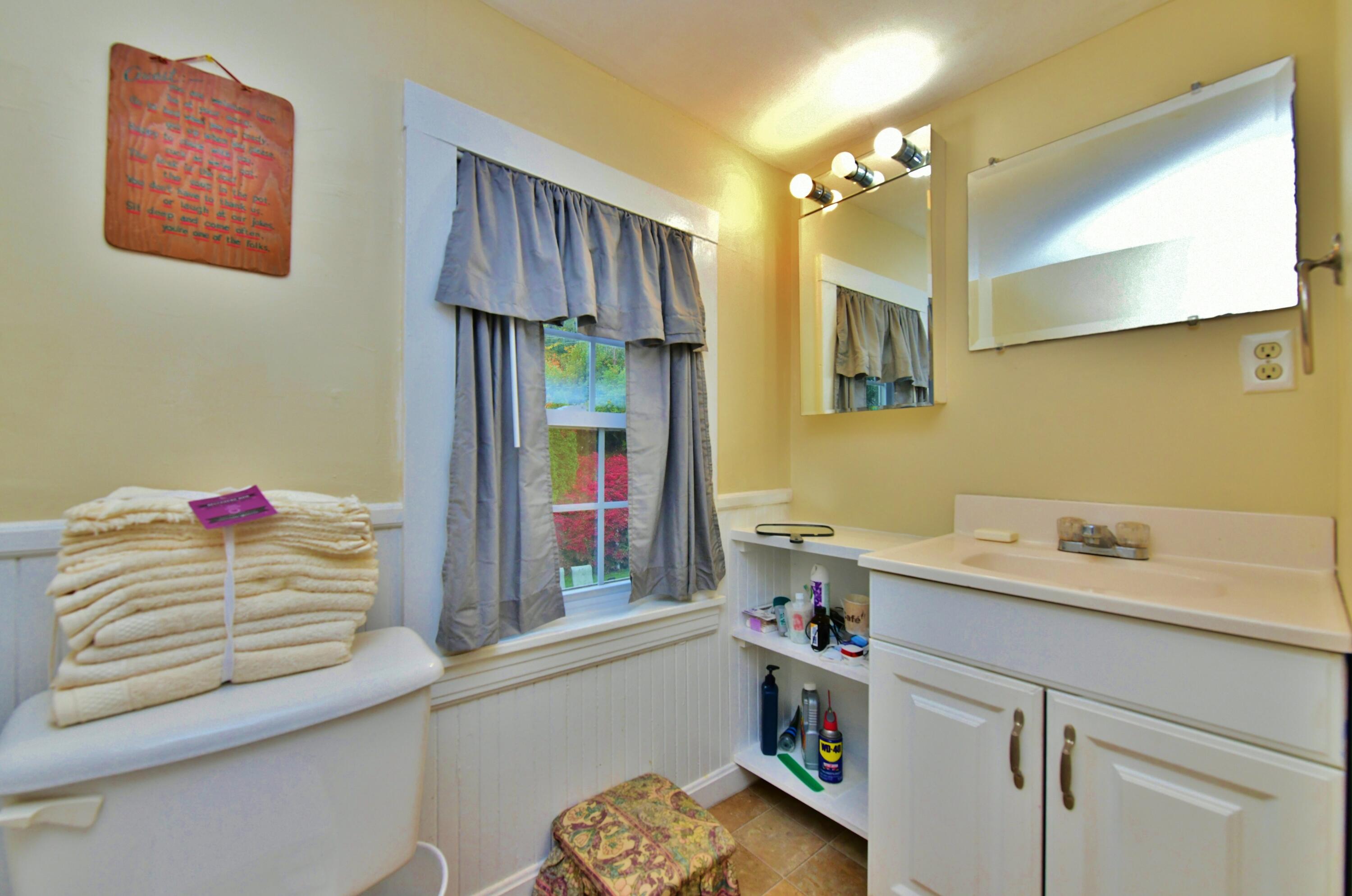 6 Bournedale Road, Unit 6B 2 Buzzards Bay, MA 02532 - Photo 22 of 36 a bathroom with a sink and a mirror