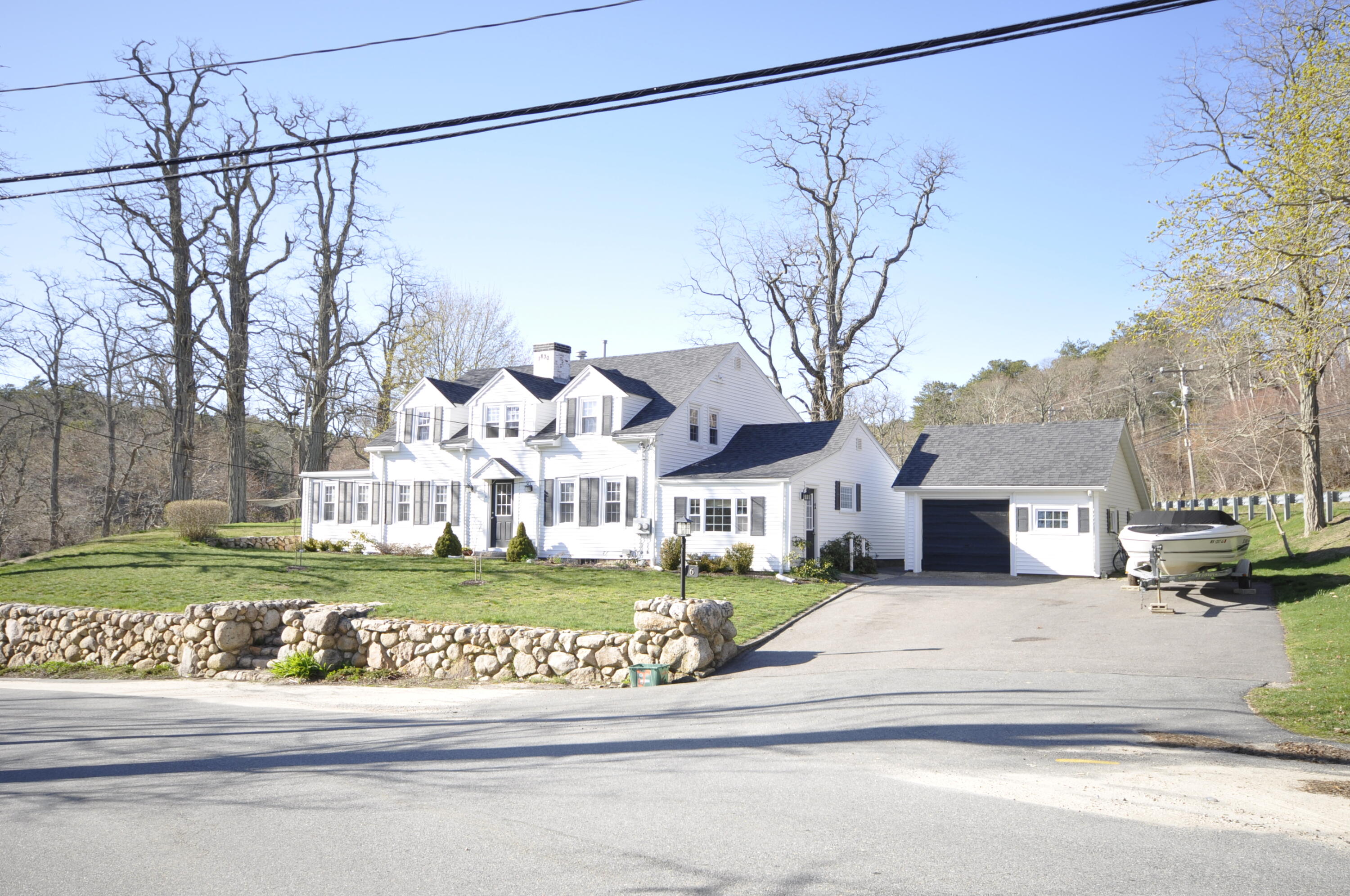 6 Bournedale Road, Unit 6B 2 Buzzards Bay, MA 02532 - Photo 26 of 36 a view of a house with a yard and garage
