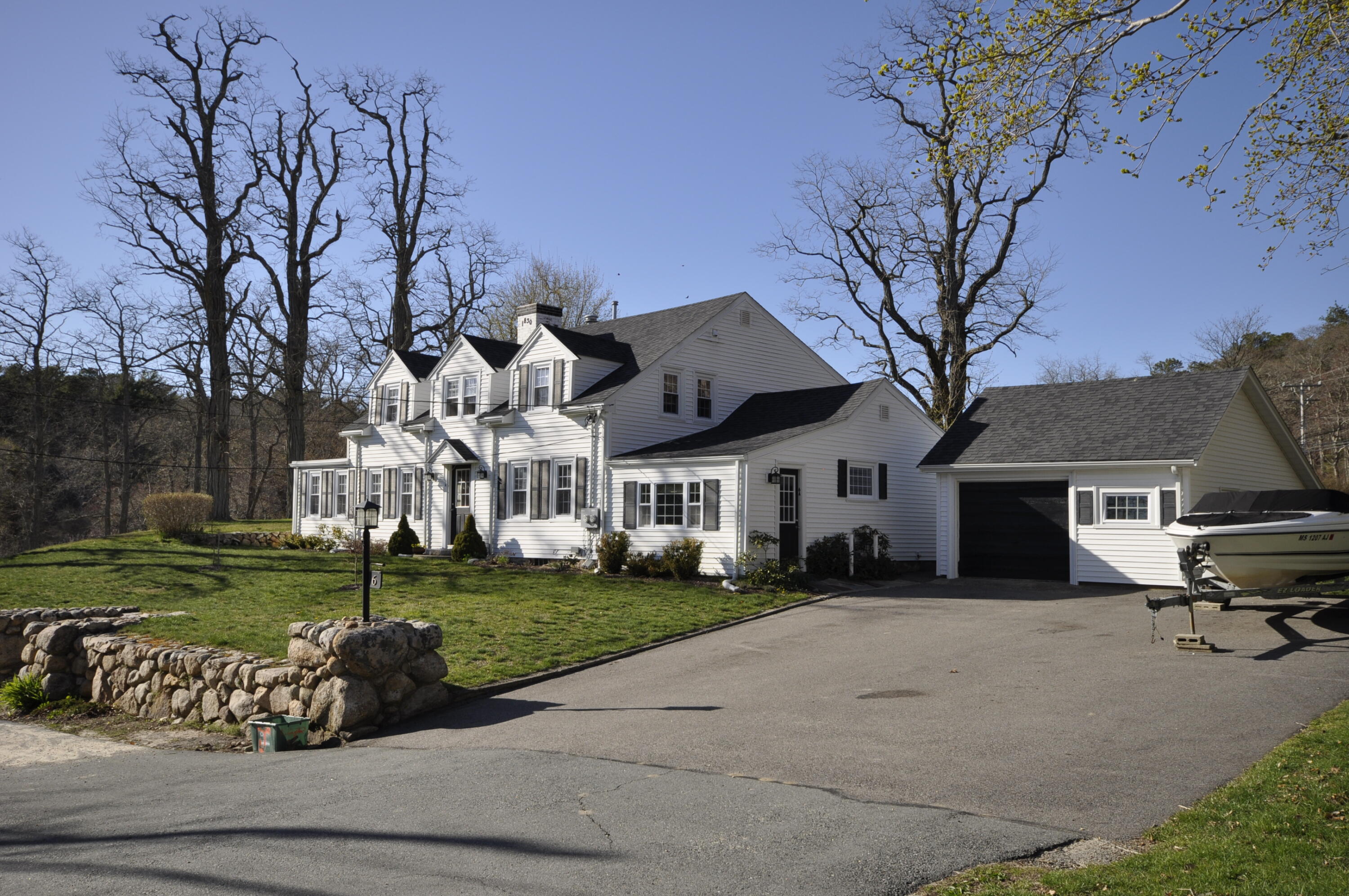 6 Bournedale Road, Unit 6B 2 Buzzards Bay, MA 02532 - Photo 28 of 36 a front view of a house with a garden and trees