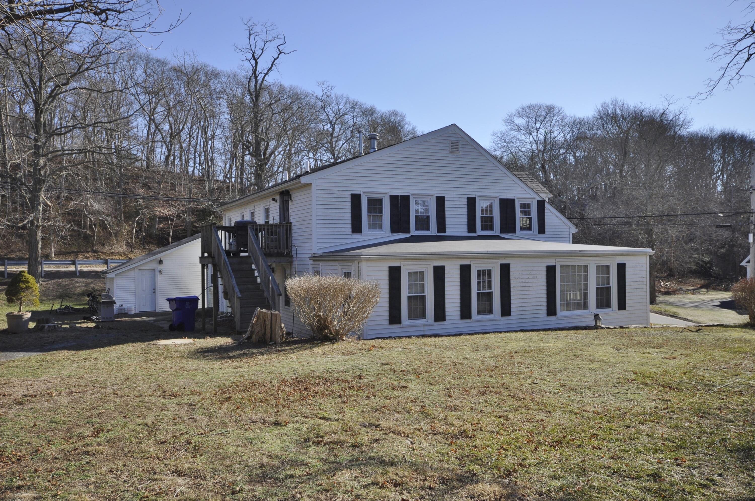 6 Bournedale Road, Unit 6B 2 Buzzards Bay, MA 02532 - Photo 33 of 36 a front view of a house with a yard