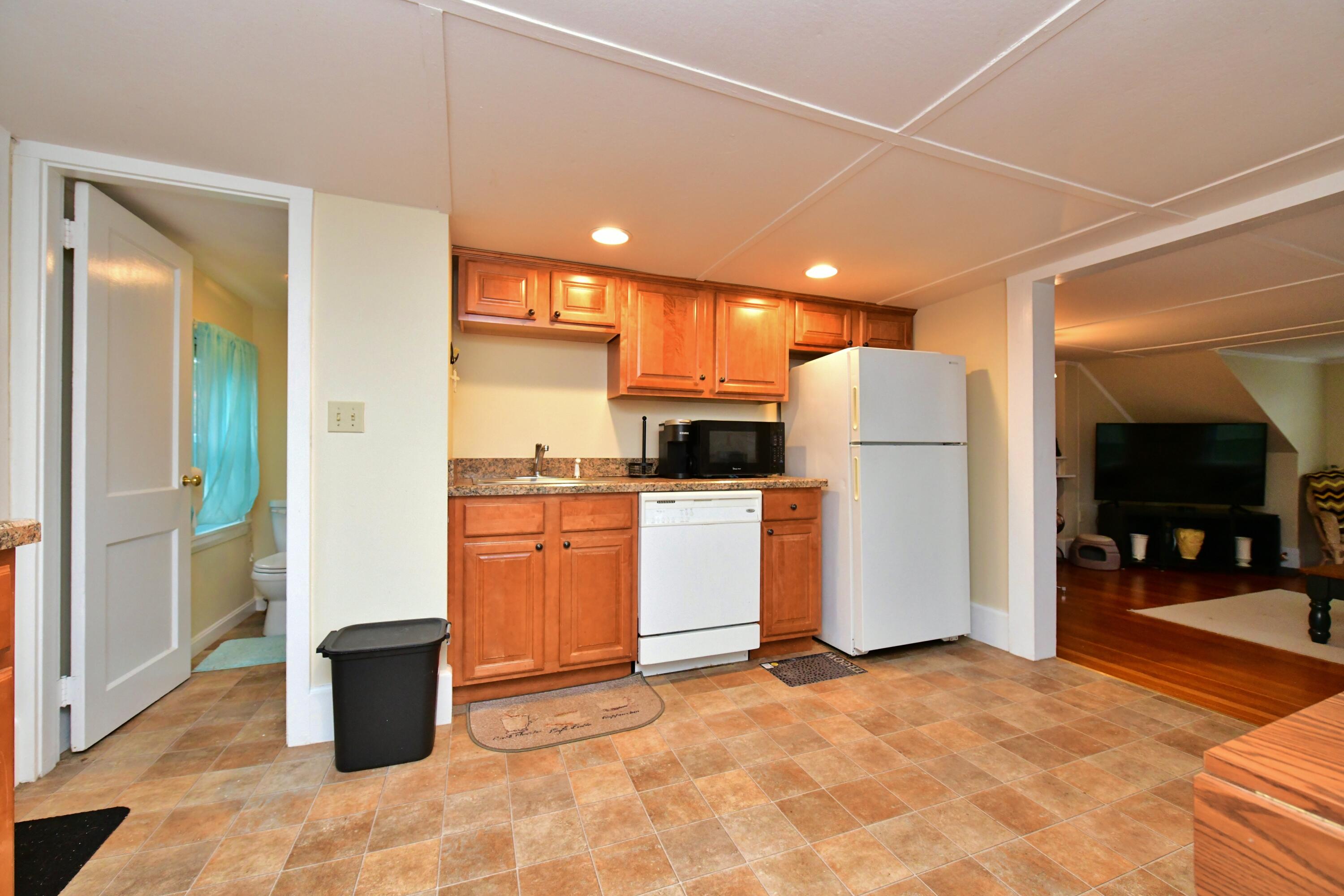 6 Bournedale Road, Unit 6B 2 Buzzards Bay, MA 02532 - Photo 6 of 36 a kitchen with a refrigerator and a stove