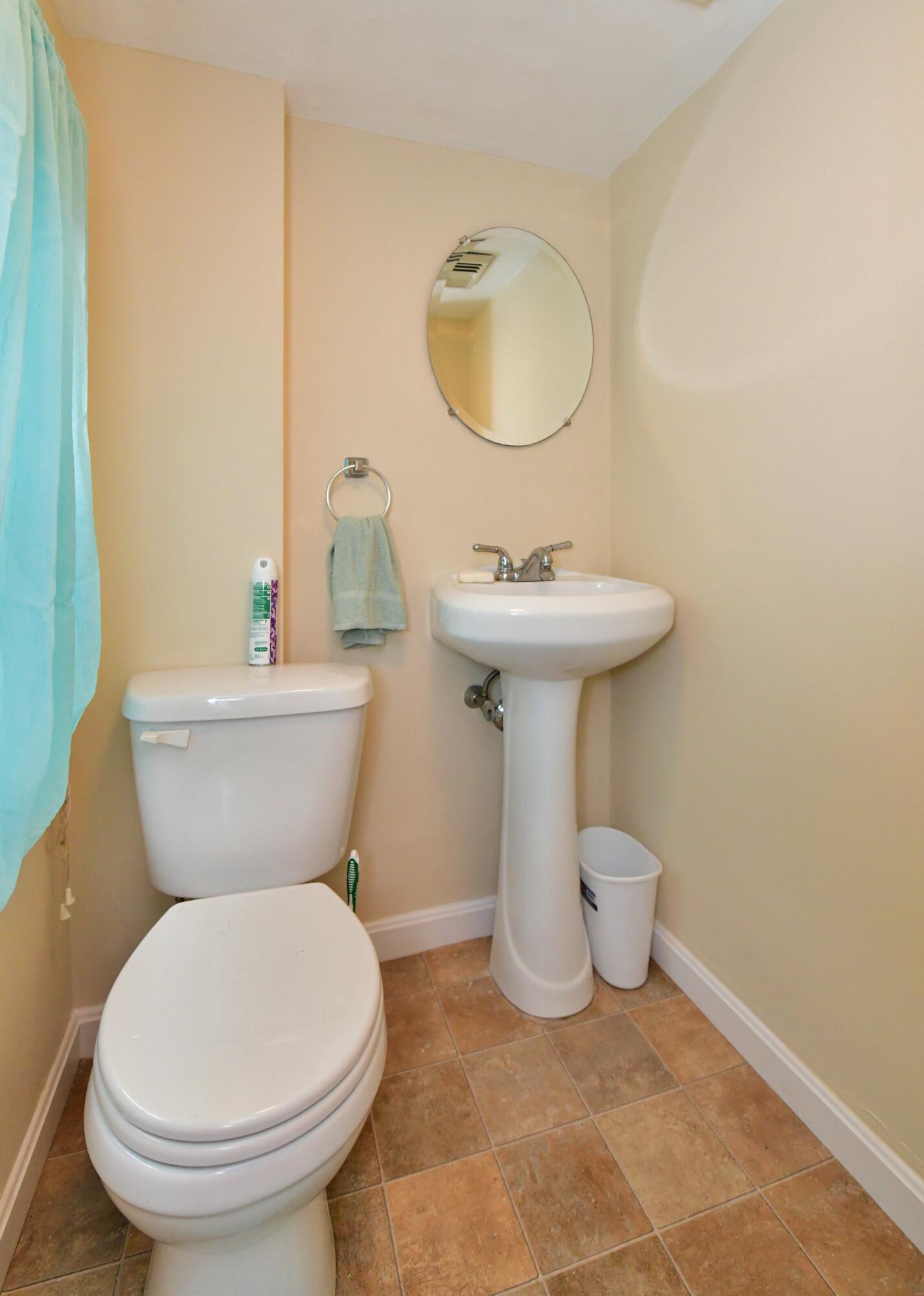 6 Bournedale Road, Unit 6B 2 Buzzards Bay, MA 02532 - Photo 7 of 36 a bathroom with a sink toilet and mirror