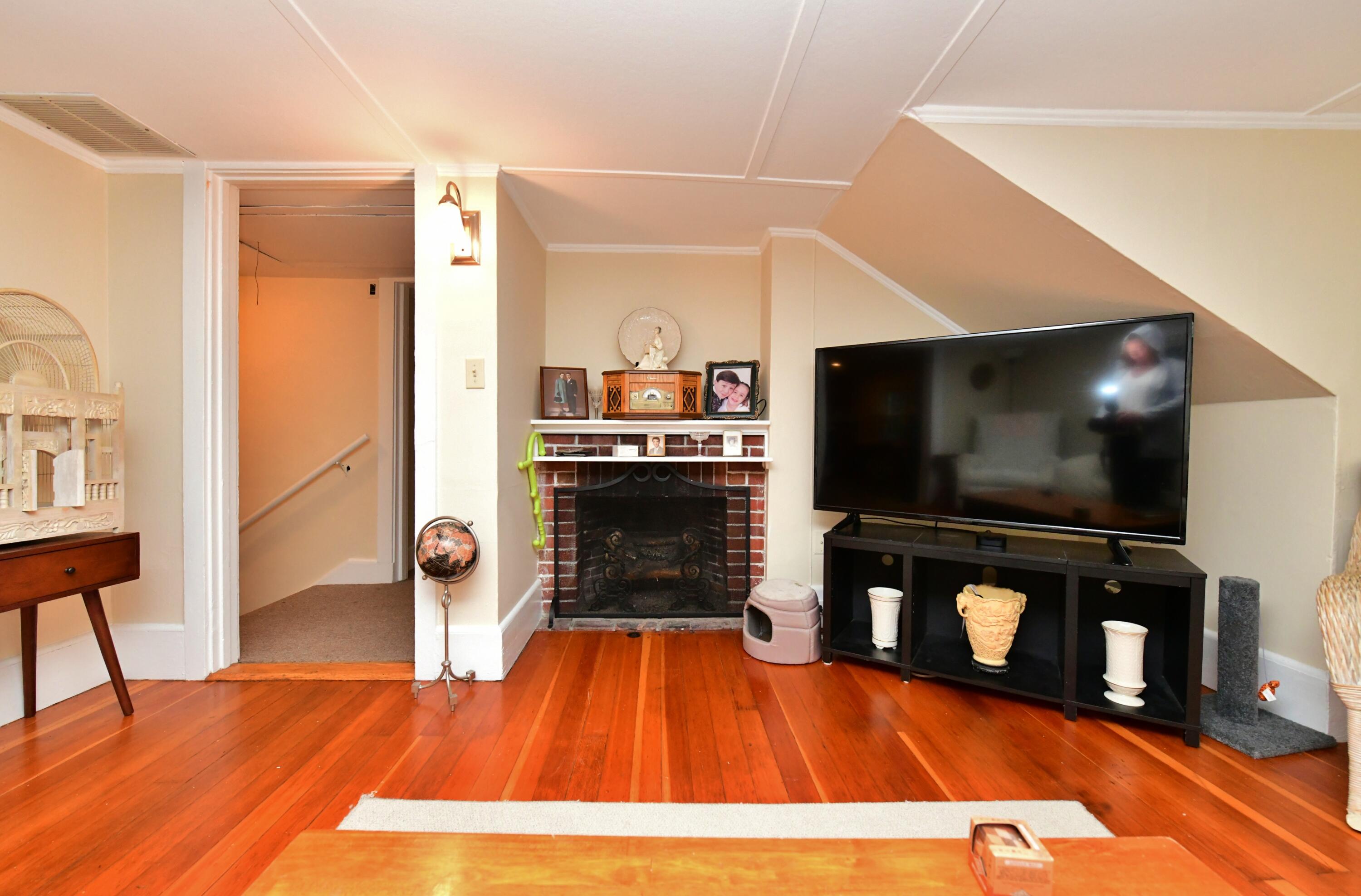 6 Bournedale Road, Unit 6B 2 Buzzards Bay, MA 02532 - Photo 10 of 36 a living room with furniture and a flat screen tv