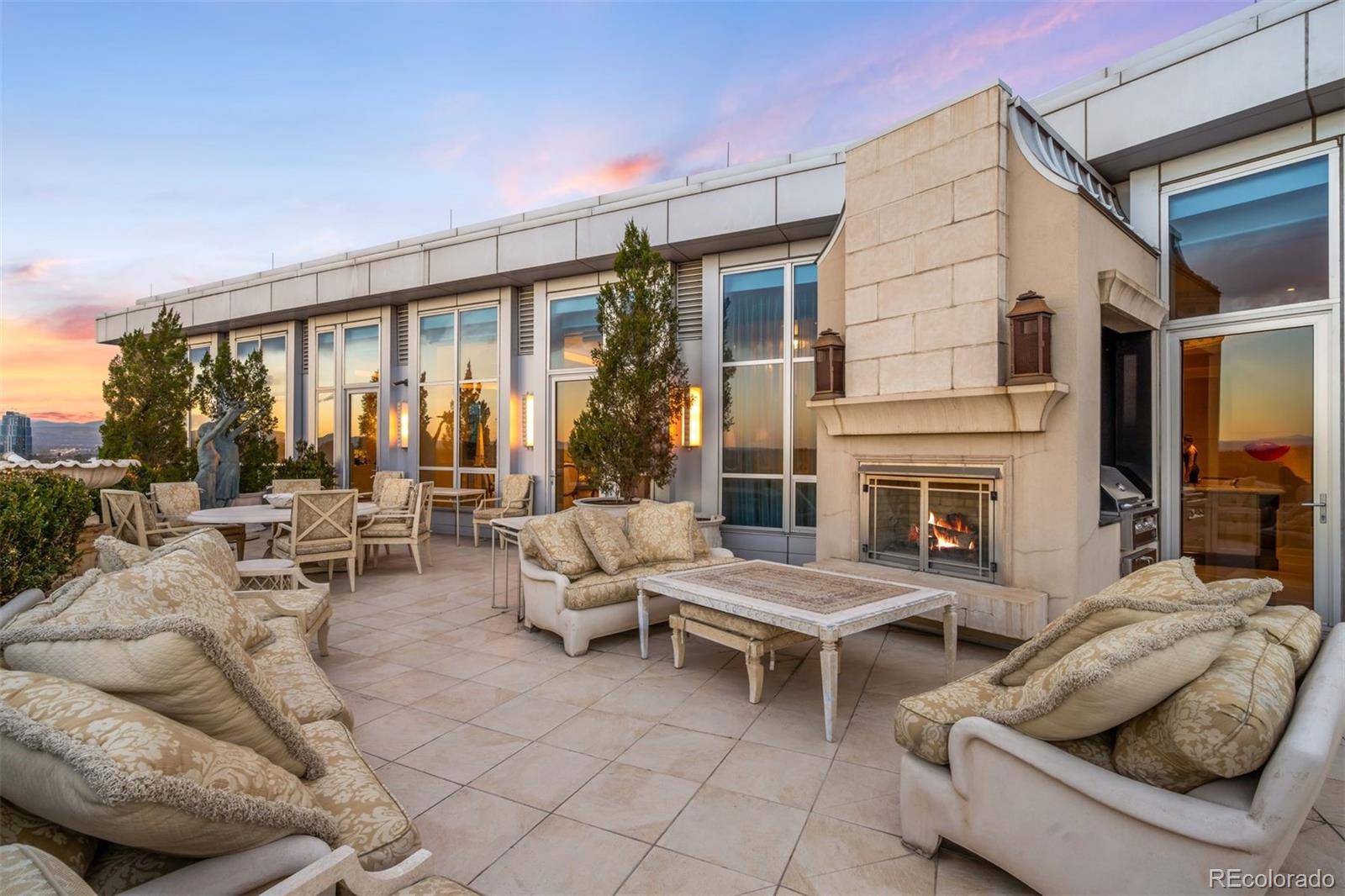 100 Detroit Street, Unit 701 Denver, CO 80206 - Photo 38 of 47 a outdoor space with patio the couches and a fireplace
