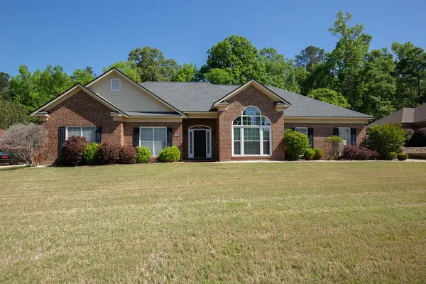 front view of a house with a yard