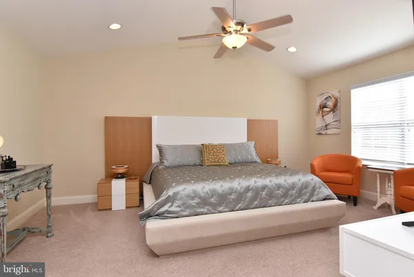 a bed room with a bed and a couch