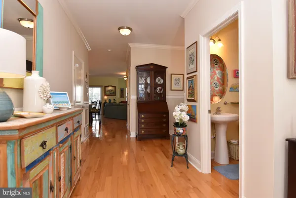 a view of hallway with wooden floor