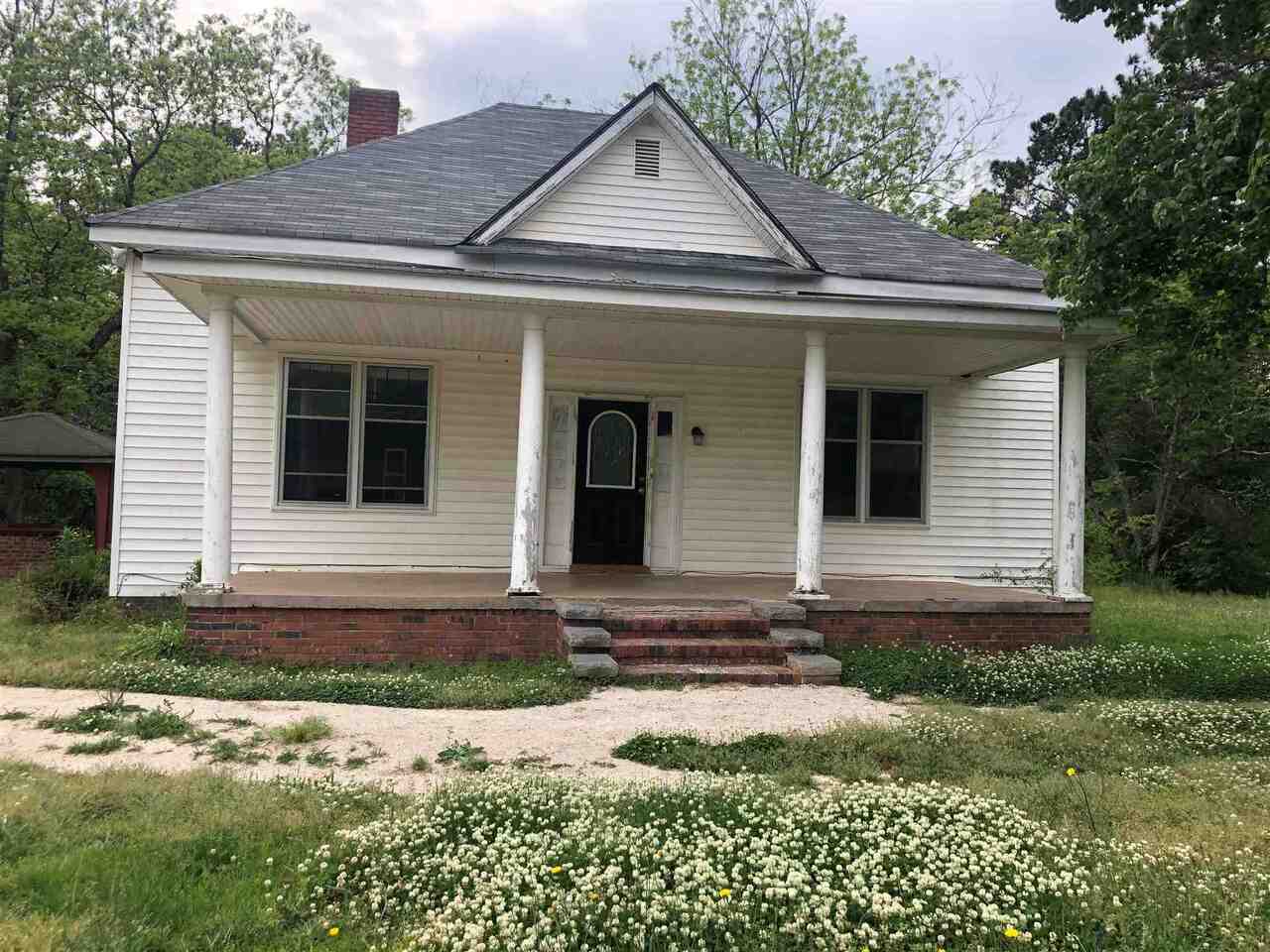 943 Covered Bridge Road Covington, GA 30016 - Photo 1 of 1 a front view of a house with garden