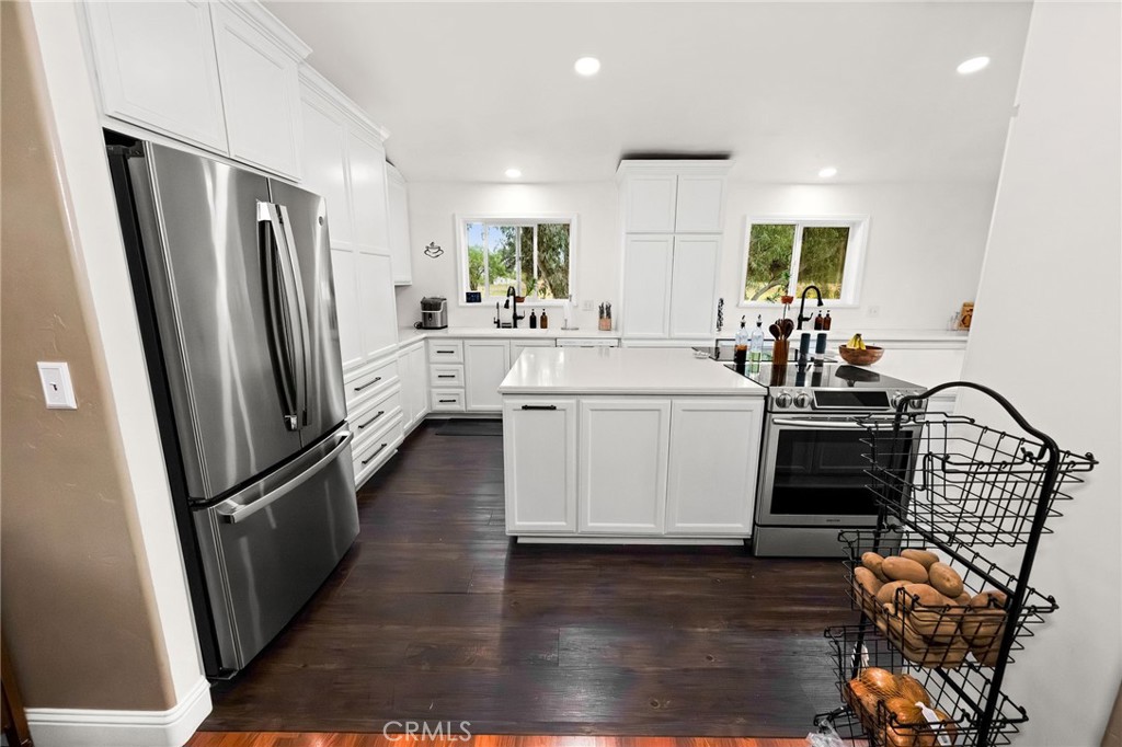 2728 Pentz Road Oroville, CA 95965 - Photo 9 of 52 a kitchen with stainless steel appliances a refrigerator a sink a stove a table and chairs