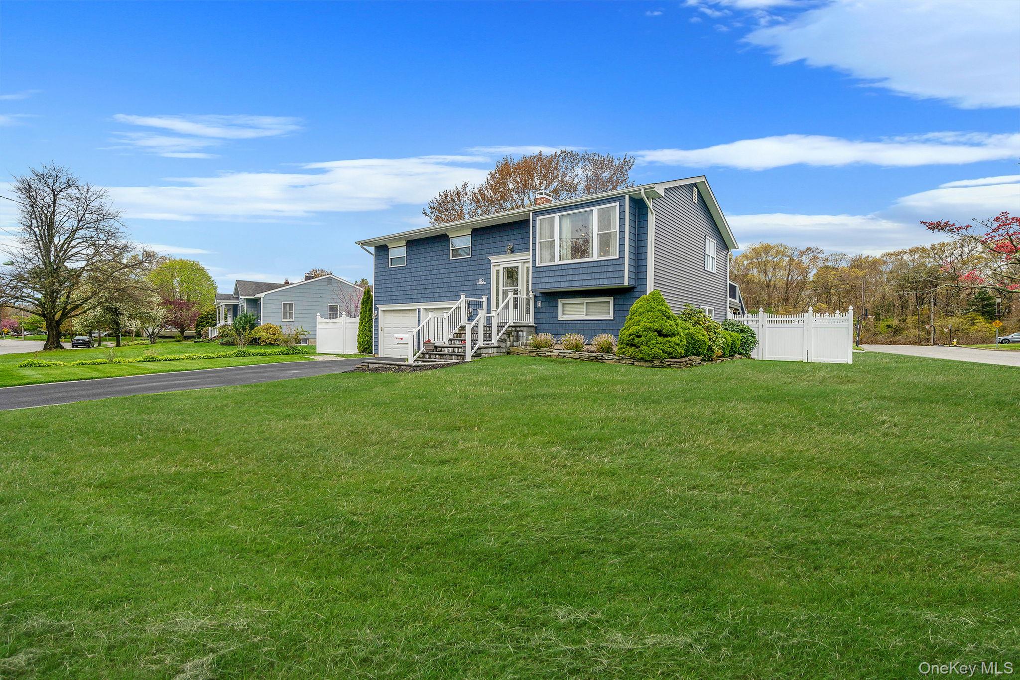110 Stephen Road Bayport, NY 11705 - Photo 2 of 39 a front view of a house with a yard