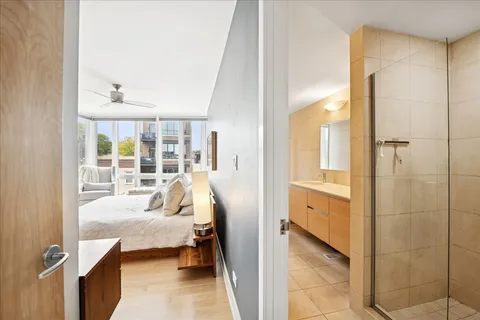 a bedroom with large bed and a couch