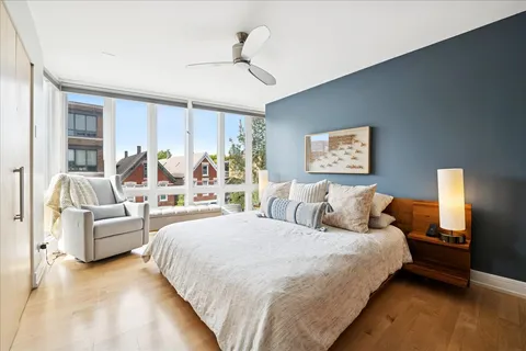 a bedroom with bed and a flat screen tv