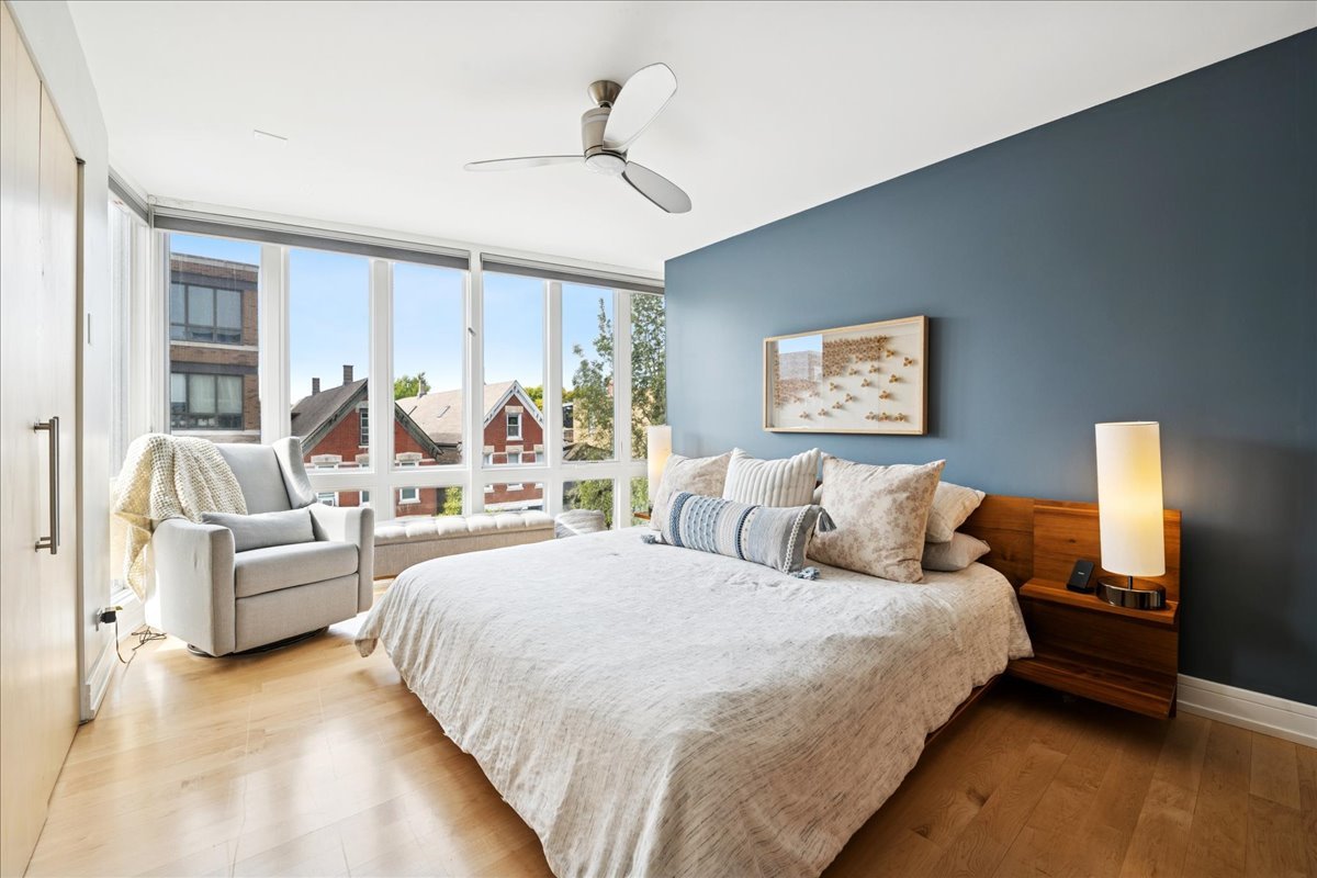 1915 North Damen Avenue, Unit A Chicago, IL 60647 - Photo 16 of 26 a bedroom with large bed and a couch