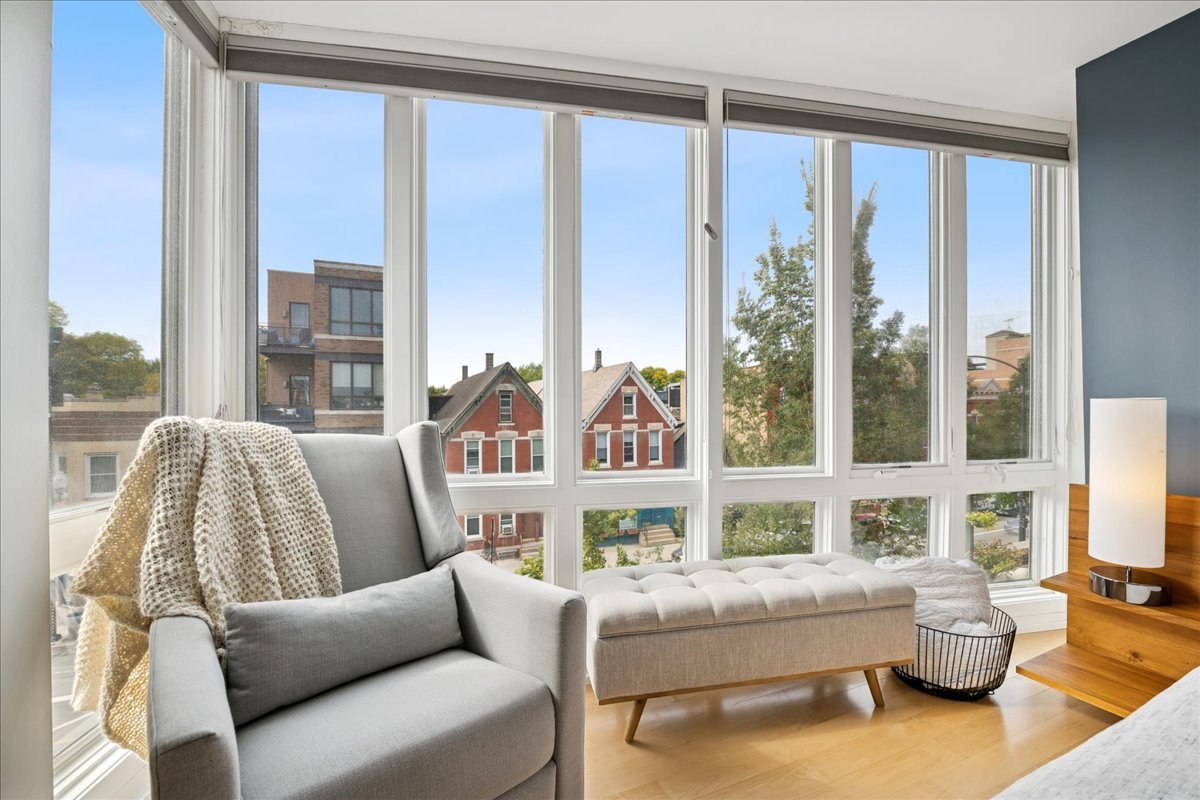 1915 North Damen Avenue, Unit A Chicago, IL 60647 - Photo 18 of 26 a living room with furniture and a large window