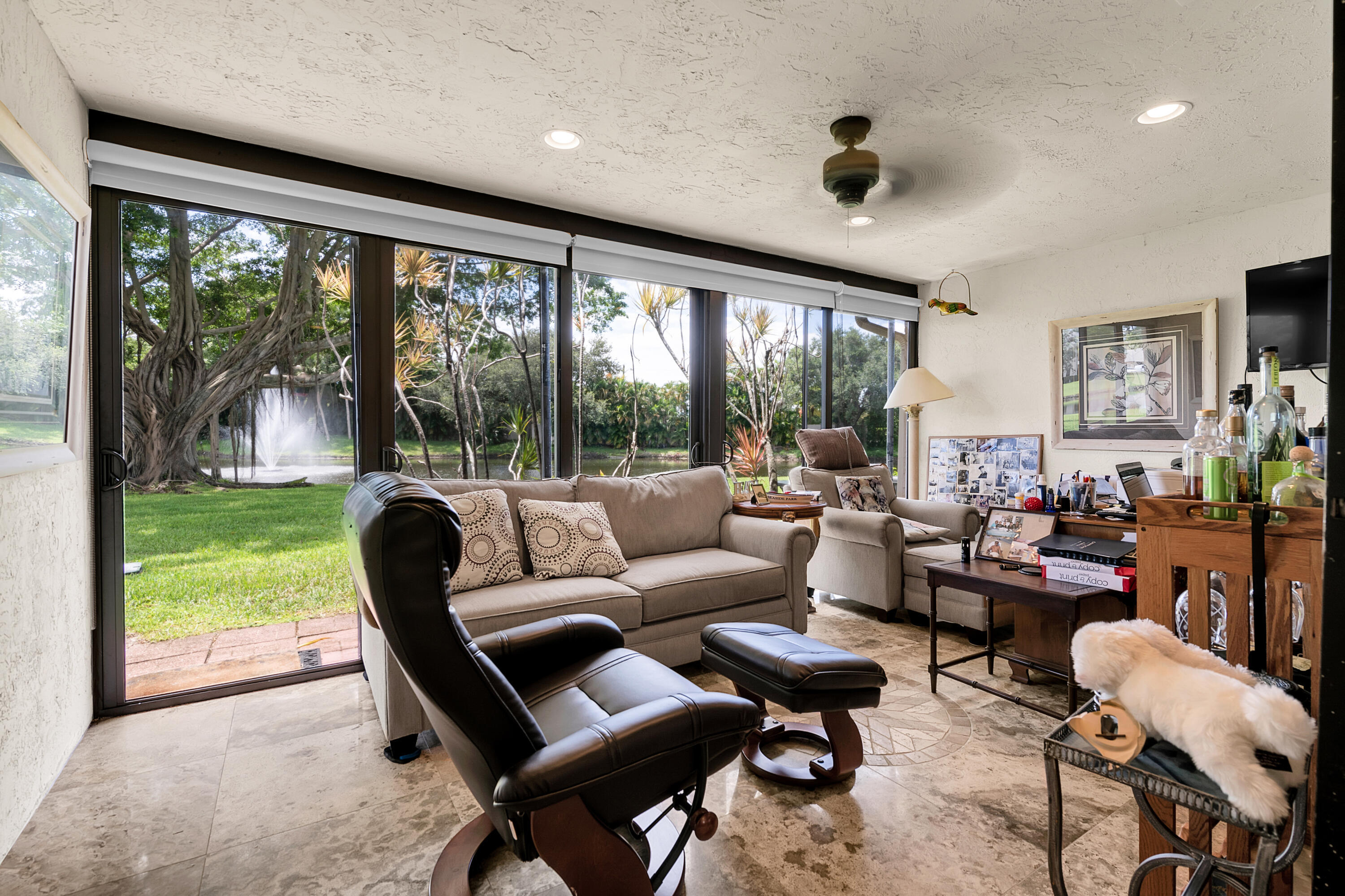 8440 Boca Glades Boulevard East Boca Raton, FL 33434 - Photo 13 of 16 a living room with furniture and a floor to ceiling window
