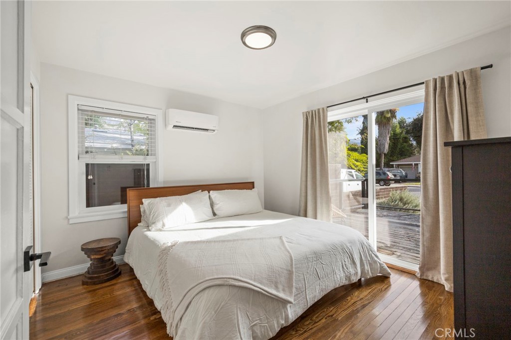 301 Park Road Ojai, CA 93023 - Photo 11 of 26 a bedroom with a bed window and a mirror