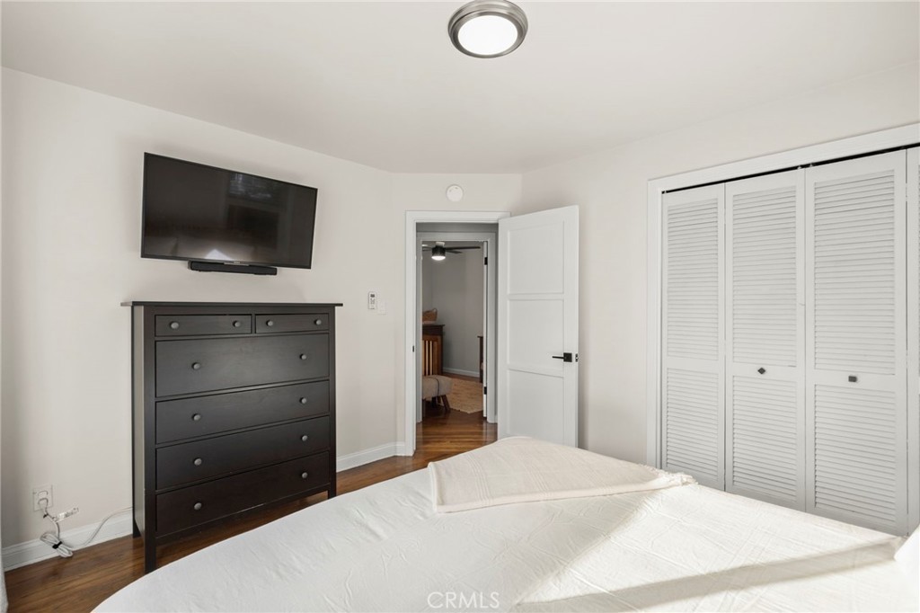 301 Park Road Ojai, CA 93023 - Photo 12 of 26 a bedroom with a bed and a flat screen tv