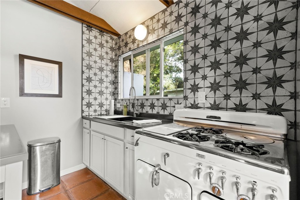 301 Park Road Ojai, CA 93023 - Photo 20 of 26 a kitchen with a stove and a sink