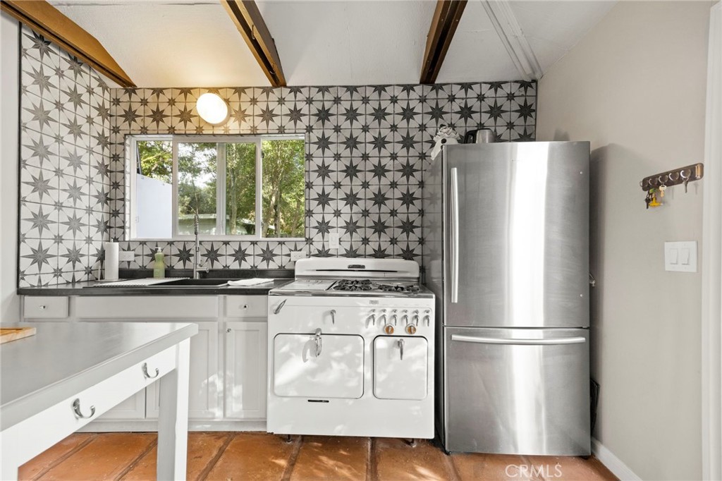 301 Park Road Ojai, CA 93023 - Photo 21 of 26 a kitchen with stainless steel appliances a refrigerator and a sink