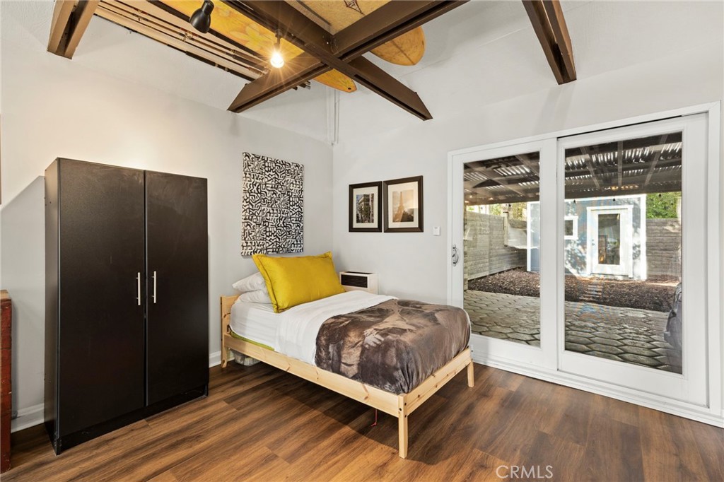 301 Park Road Ojai, CA 93023 - Photo 23 of 26 a bedroom with a bed and glass door