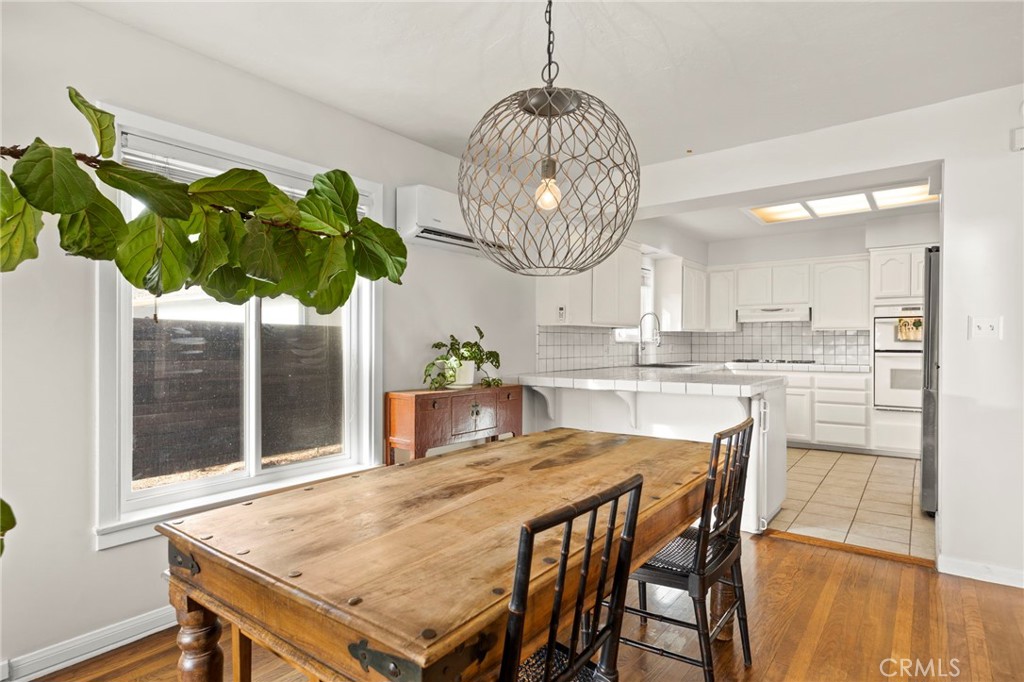 301 Park Road Ojai, CA 93023 - Photo 6 of 26 a room with stainless steel appliances a table chairs and chandelier