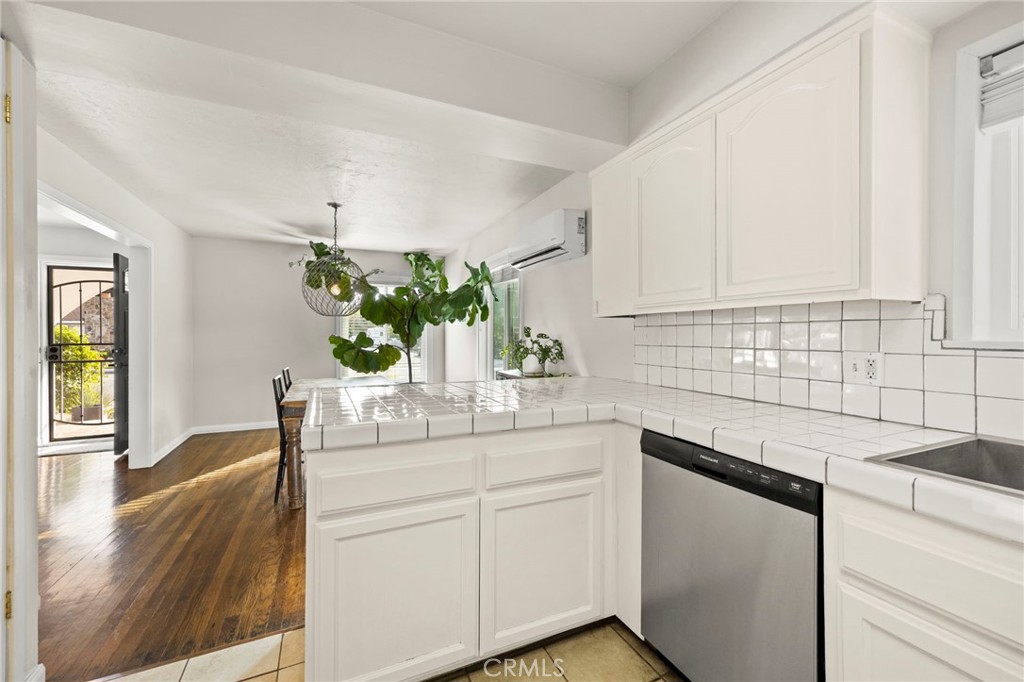 301 Park Road Ojai, CA 93023 - Photo 10 of 26 a kitchen with a sink and cabinets