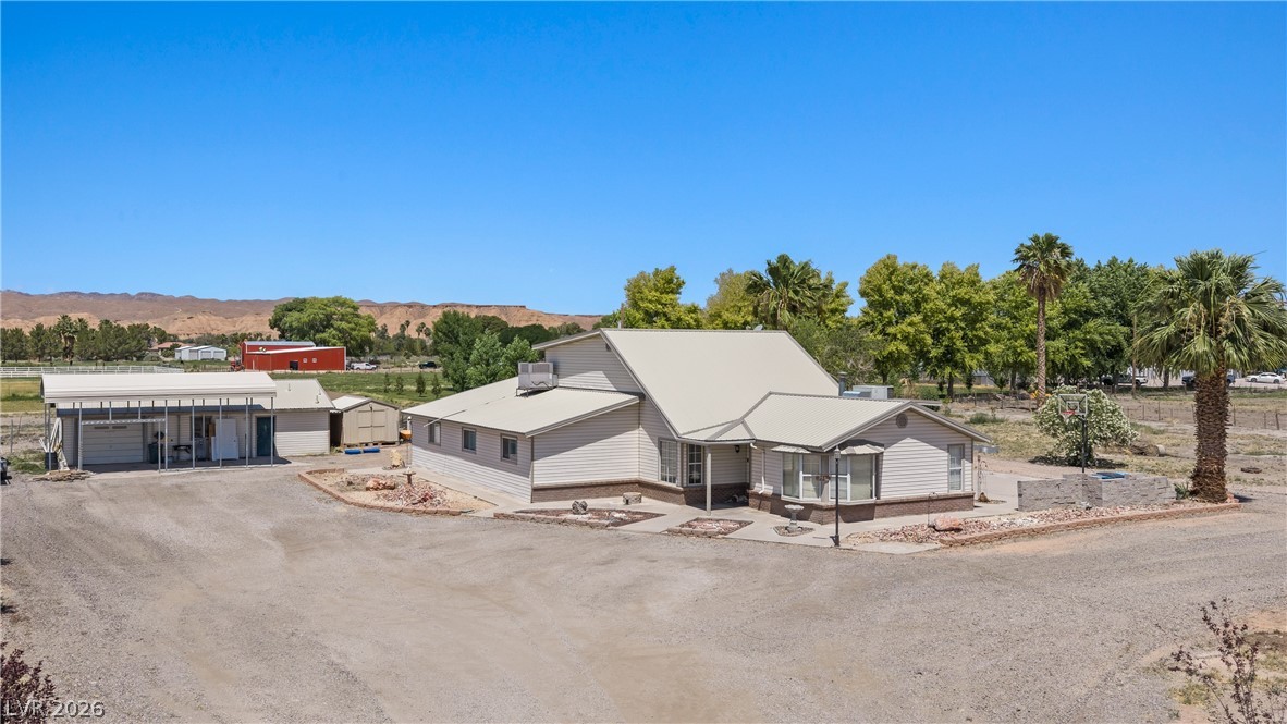 750 Leming Avenue Overton, NV 89040 - Photo 2 of 82 This spacious property offers a serene retreat with expansive outdoor living and picturesque mountain views.