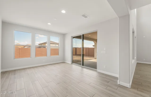a kitchen with stainless steel appliances granite countertop a sink stove and wooden floor