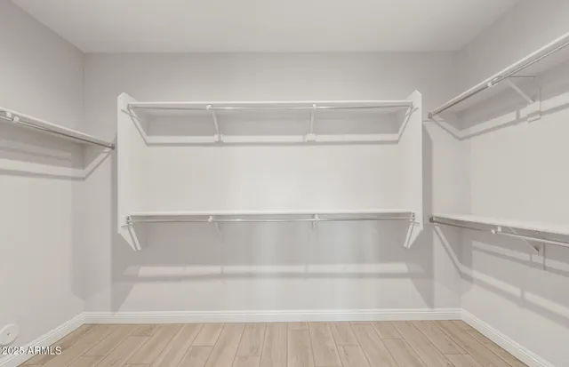 a bathroom with a shower sink and mirror