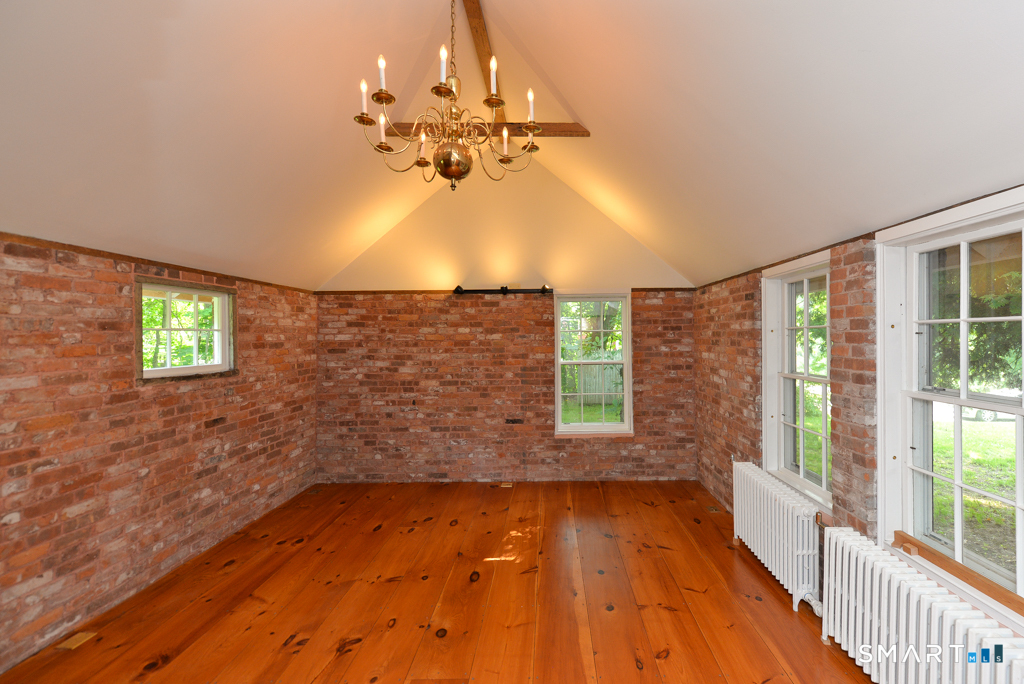 15 Hawkins Road Southbury, CT 06488 - Photo 12 of 26 wooden floor in an empty room with a window