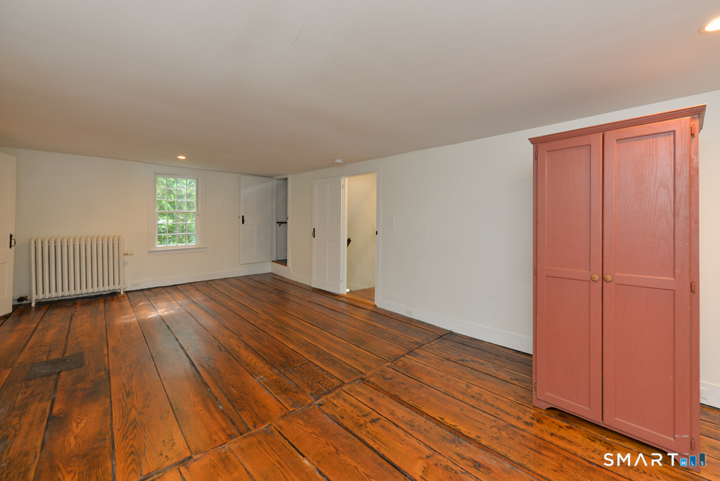 15 Hawkins Road Southbury, CT 06488 - Photo 17 of 26 wooden floor in an empty room with a window